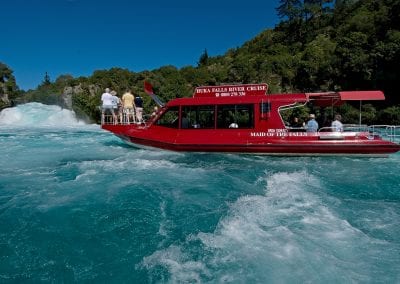 Passengers on Huka Falls River Cruise enjoying the views